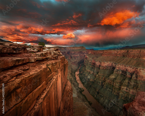 The afterglow of the setting sun illuminates the Colorado River under Toroweap, a remote location in the Grand Canyon.