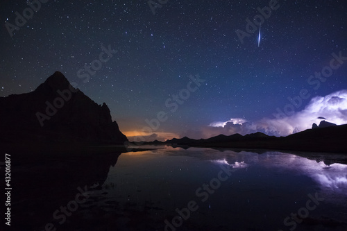 Anayet Peak at night and storm over Pic du Midi d'Ossau. Pyrenees. Huesca province. Aragon. Spain.