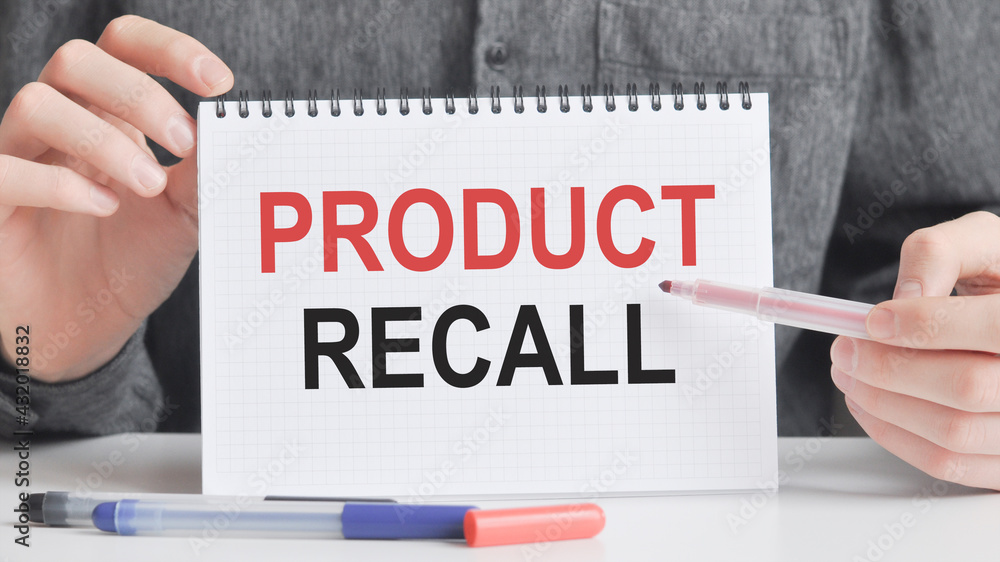 businessman showing a card with text product recall, business and positive concept businessman showing a card with text product recall, business and positive concept
