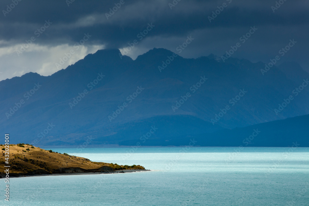 A rainstorm clears from Aoraki / Mt. Cook National Park revealing the aqua-colored glacial melt of Lake Pukaki and the rugged peaks of the Southern Alps in New Zealand's South Island. A rainstorm clears from Aoraki / Mt. Cook National Park revealing the aqua-colored glacial melt of Lake Pukaki and the rugged peaks of the Southern Alps in New Zealand's South Island.