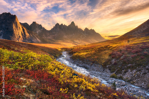 Beautiful sunset light and colorful tundra looking toward Tombstone Mountain during Autumn in the Ogilvie Mountain wilderness, Yukon Territory. photo