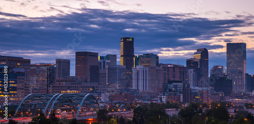 The skyline of Denver, CO at sunrise on a summer morning. photo