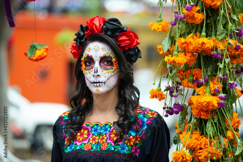 Fotografie Woman's face with ceremonial make-up also known as Sugar skull, used in traditio