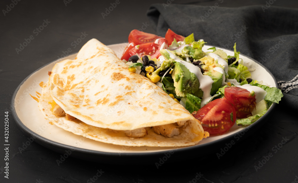 Chicken quesadilla with bean salad and avocado Chicken quesadilla with bean salad and avocado