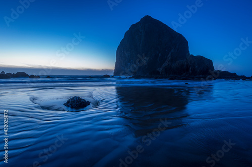 Haystack Rock in cold winter dusk blues at Cannon Beach