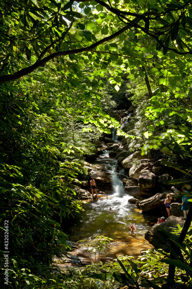 people swimming at skinny dip falls near blue ridge parkway, north Carolina people swimming at skinny dip falls near blue ridge parkway, north Carolina