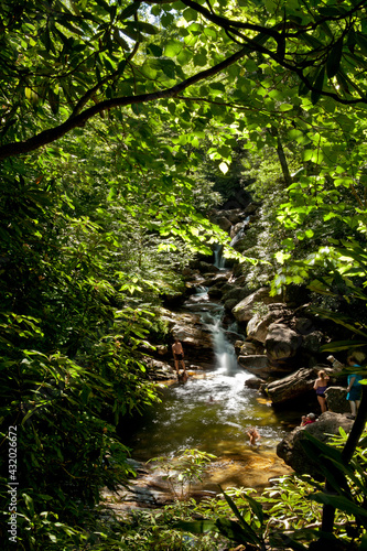 people swimming at skinny dip falls near blue ridge parkway, north Carolina