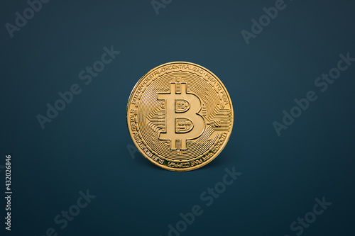 Bitcoin cryptocurrency gold coins on a blue background