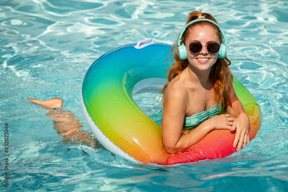 Woman on swim ring. Summer mood concept. Pool resort. Summertime days. Vacation, summer holiday.