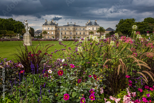A view of the Senate Building against an ominous sky in the Luxembourg Gardens, Paris, France. photo