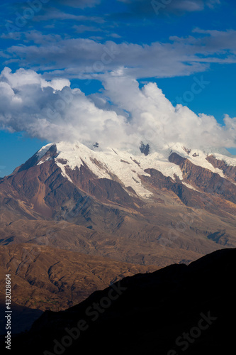 Mt. Illimani at sunset as seen from La Paz, Bolivia. The southernmost extension of the Cordillera Real is anchored by Mt. Illimani, the sentinel of La Paz.