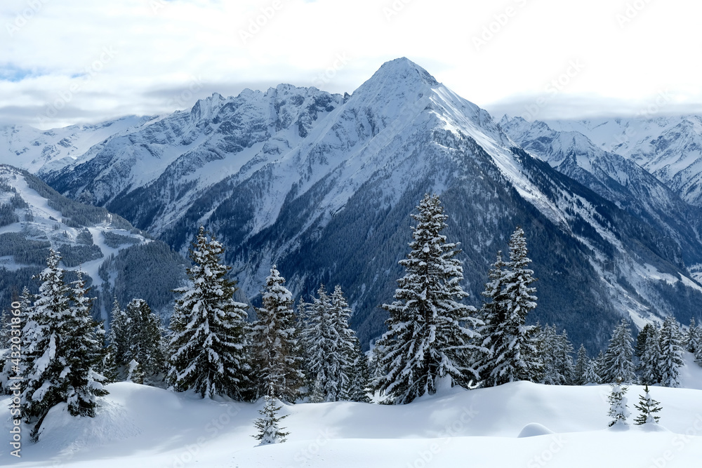 Landscape at Penken ski resort in Zillertal in Tyrol. Austria in winter in Alps. Alpine mountains with snow. Blue sky and white slopes.