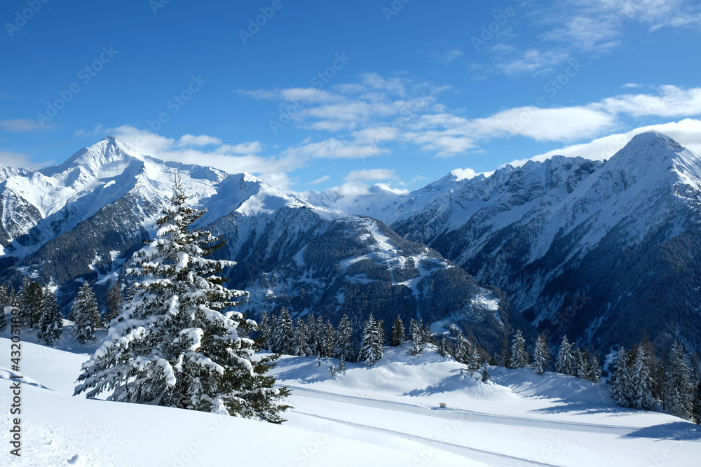 Landscape at Penken ski resort in Zillertal in Tyrol. Austria in winter in Alps. Alpine mountains with snow. Blue sky and white slopes.