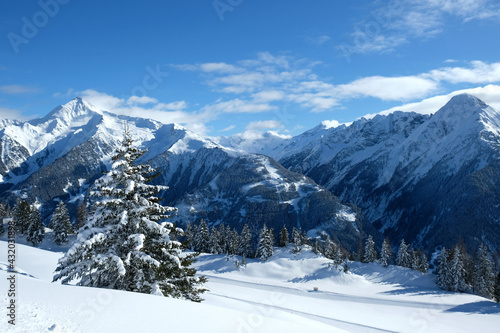 Landscape at Penken ski resort in Zillertal in Tyrol. Austria in winter in Alps. Alpine mountains with snow. Blue sky and white slopes. © Daria