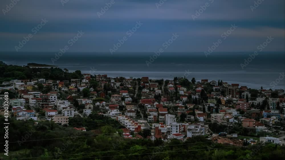 Time laps overlooking the sea and passing clouds in Montenegro. The transition from day to evening time in an accelerated temp. A small village in the community area of the city of Bar, Montenegro. Time laps overlooking the sea and passing clouds in Montenegro. The transition from day to evening time in an accelerated temp. A small village in the community area of the city of Bar, Montenegro.