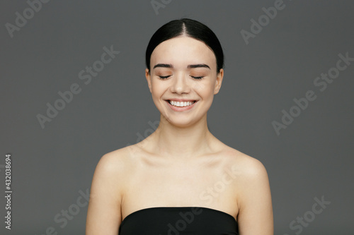 Young beautiful woman face close-up