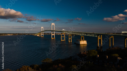 Fototapeta Naklejka Na Ścianę i Meble -  Late Evening Aerial Views of Historic Newport Suspension Bridge - East Passage Narragansett Bay - Rhode Island