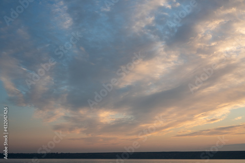 Beautiful sky at sunset and a thin line of the horizon. Creative vintage background. © Виктор Кеталь