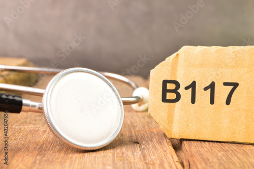 Stethoscope and label tag written with B117. B117 is a varian photo