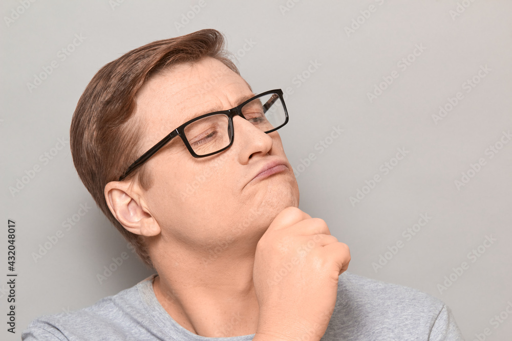 Portrait of funny thoughtful blond mature man with glasses Portrait of funny thoughtful blond mature man with glasses