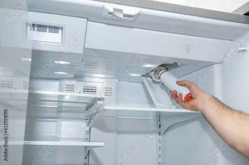 Removing a refrigerator air filter