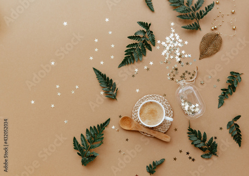 Flat lay White cup of coffee on brown background from above. Still life, lifestyle minimal concept. Top view with copy space