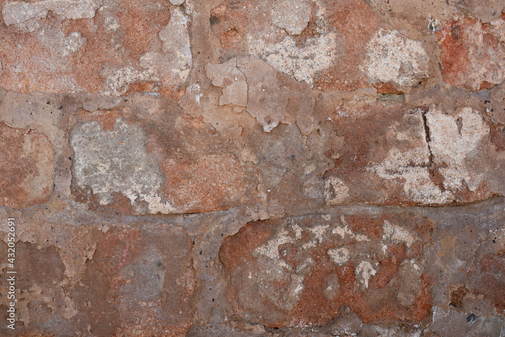 Ancient ruined wall made of natural stone. Creative vintage background. Ancient ruined wall made of natural stone. Creative vintage background.