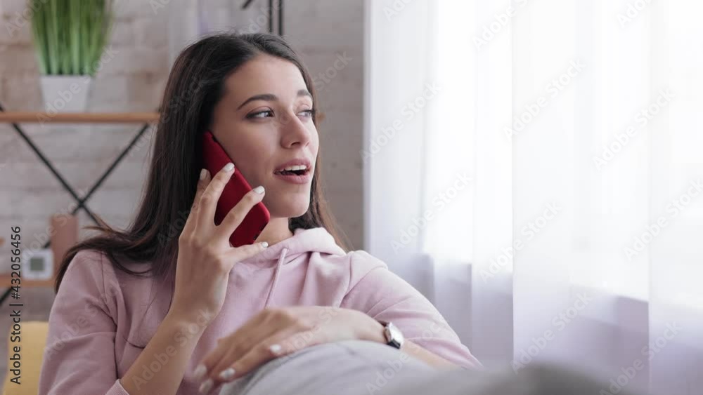 Close up portrait Joyful smiling woman speaks on the phone at home. Brunette Girl speaking on smartphone. Joyful Caucasian happy woman talking on mobile phone at home. Lifestyle concept. Close up portrait Joyful smiling woman speaks on the phone at home. Brunette Girl speaking on smartphone. Joyful Caucasian happy woman talking on mobile phone at home. Lifestyle concept.