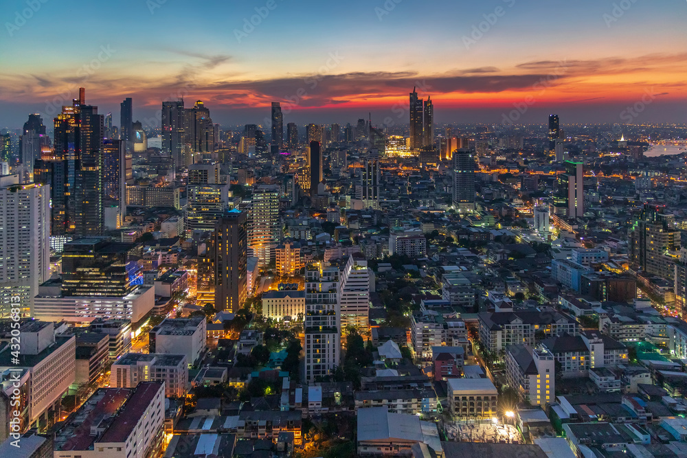 Sunset panorama aerial view in the middle of Bangkok cityscape skyline .Night scene before sunrise , Thailand.