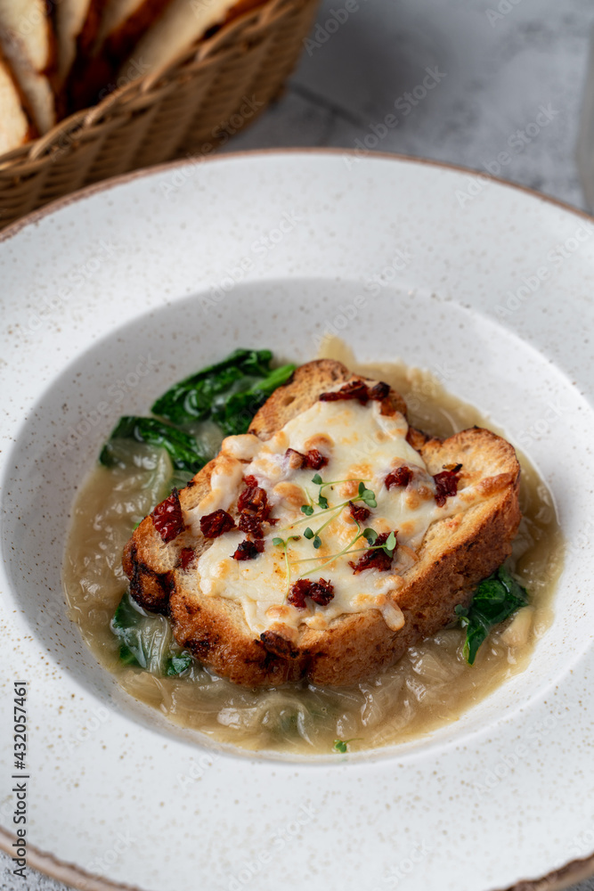 Soft croque monsieur with onion, cheese and spinach, expensive fancy restaurant menu Soft croque monsieur with onion, cheese and spinach, expensive fancy restaurant menu