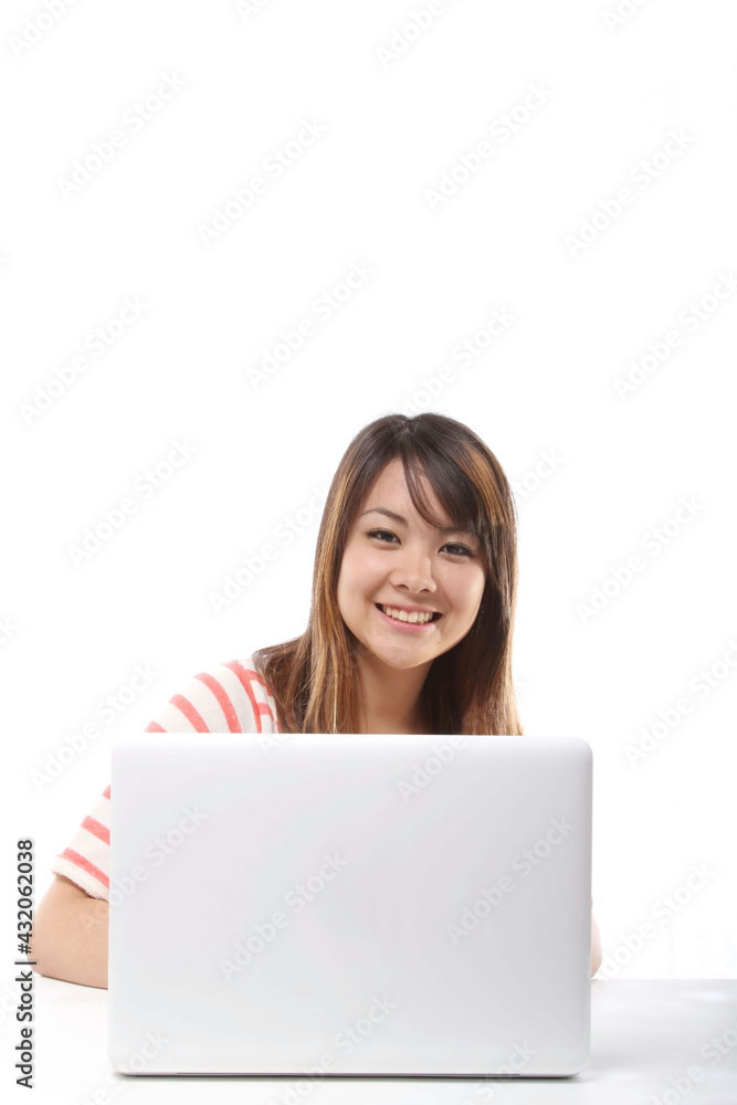 Young Japanese female student operating a personal computer Young Japanese female student operating a personal computer