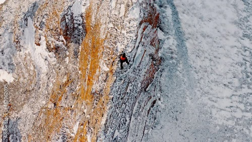 The Red Ridge rock Eastern slope of the Torgash ridge Walking man on the peak of a hill Winter Cliffs Russia Siberia Krasnoyarskiy Kray Krasnoyarsk