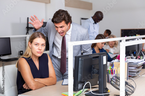 Quadro su tela Male angry boss blaming female office worker in office