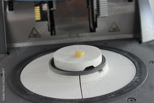 firing the zirconia crown in the oven with high temperature. Dental crown.