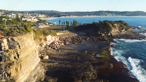 Drone aerial shot pan of ocean reef headland coastline at The Skillion Terrigal Haven tourism Central Coast NSW Australia 3840x2160 4K photo