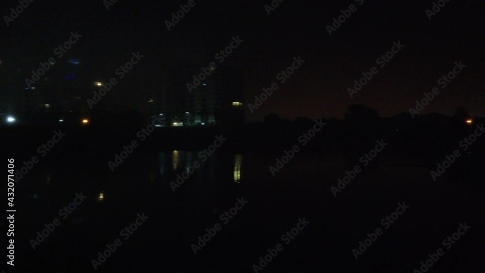 Right To Left Pan Of Forest Apartment Complex At Night Searching For Missing Persons Right To Left Pan Of Forest Apartment Complex At Night Searching For Missing Persons