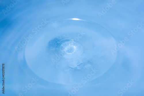 Water droplet on blue nature background with copy space.
