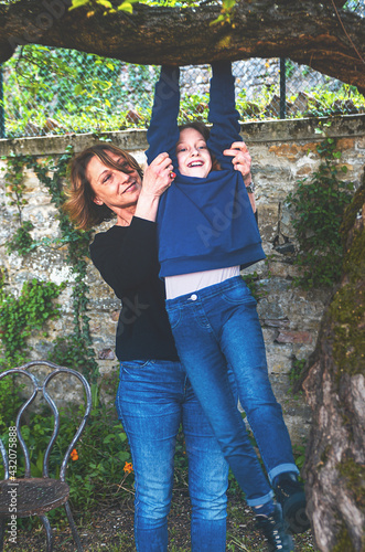 Mother and daughter together in the garden photo