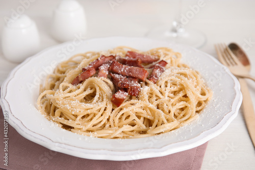 Delicious Carbonara pasta on white table, closeup