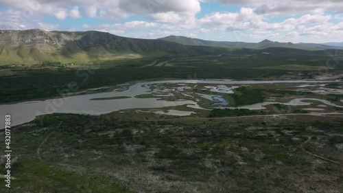River estuary flows into sea in South African pristine landscape - Aerial