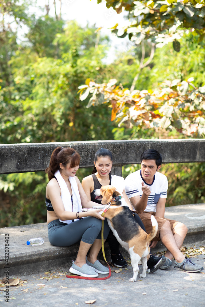 Woman and dog running and exercising outdoor in the park Woman and dog running and exercising outdoor in the park