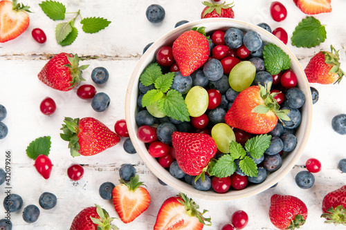 Various fresh forest berries on white background. Organic food concept.