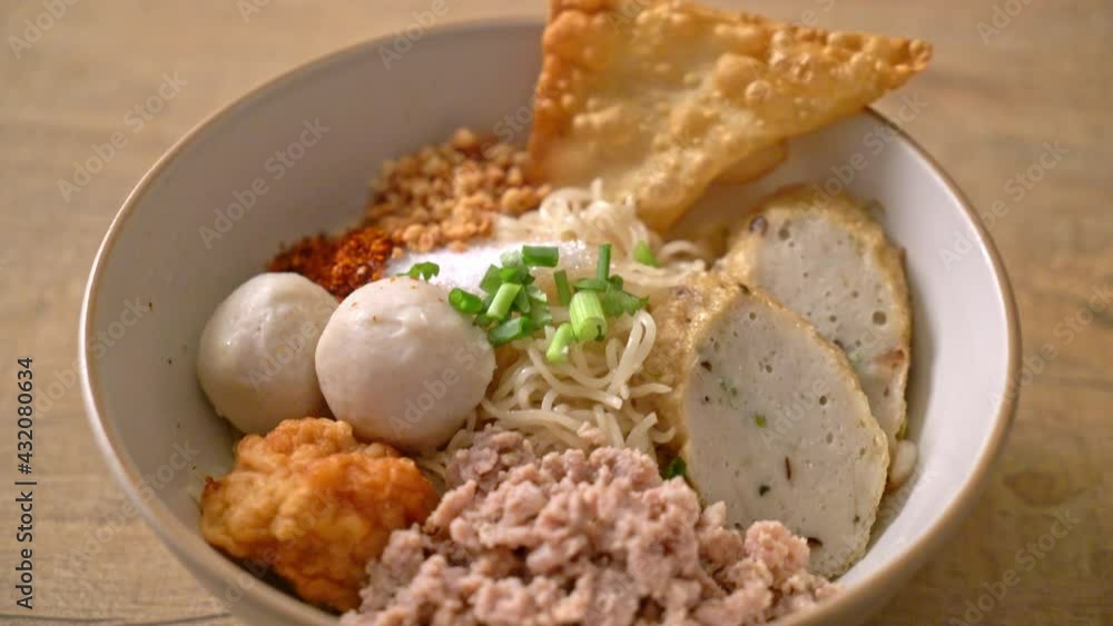 spicy egg noodles with fish balls and shrimp balls without soup - Asian food style spicy egg noodles with fish balls and shrimp balls without soup - Asian food style
