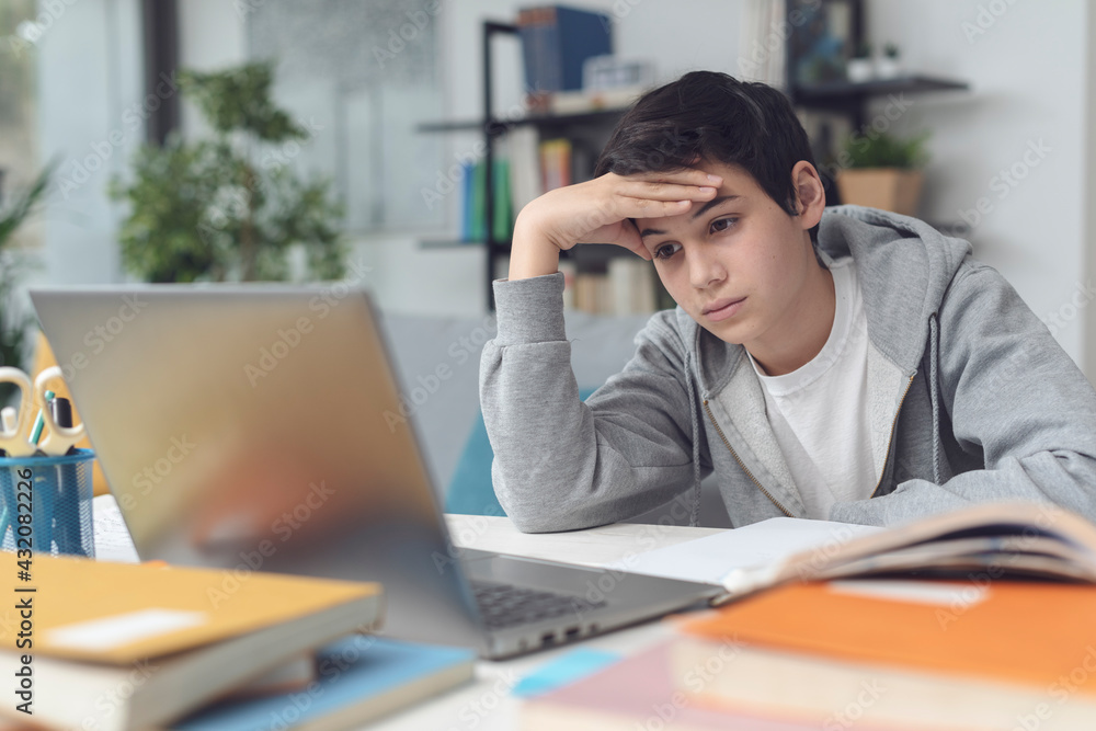 Tired student taking online classes Tired student taking online classes