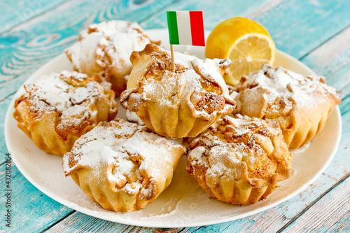 Traditional italian pastries soffioni with ricotta lemon cream