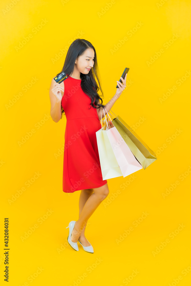 Portrait beautiful young asian woman smile with shopping bag Portrait beautiful young asian woman smile with shopping bag