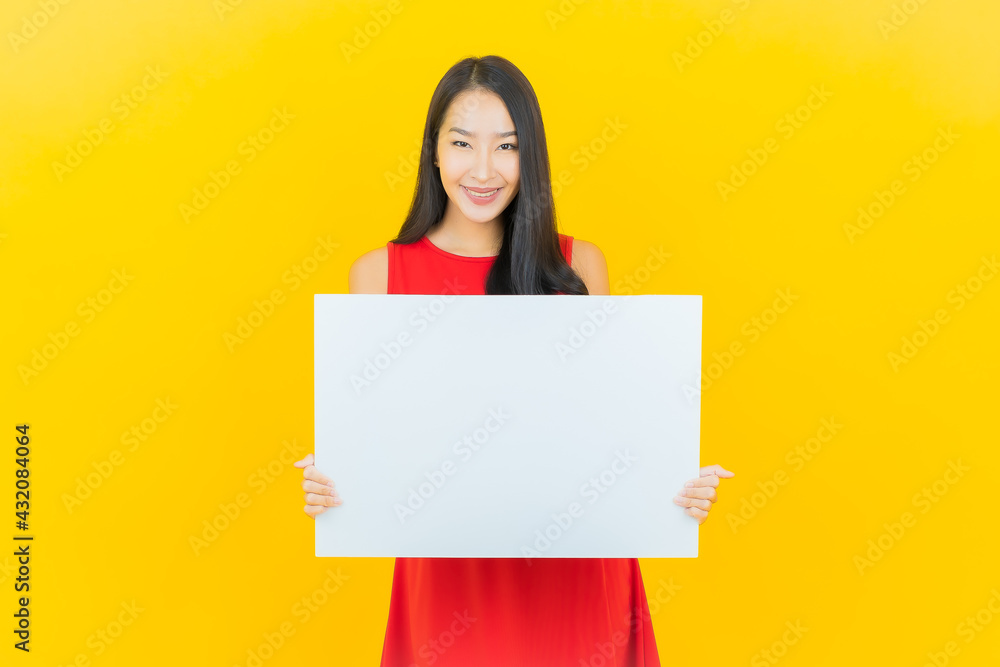 Portrait beautiful young asian woman smile with empty white billboard Portrait beautiful young asian woman smile with empty white billboard