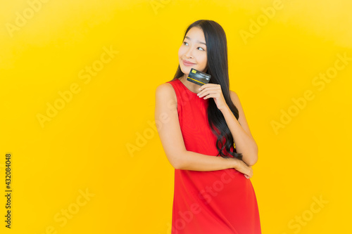 Portrait beautiful young asian woman smile with credit card