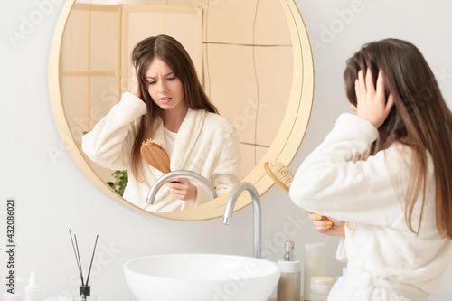 Stressed young woman with h...