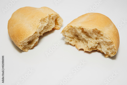 Bread cut in half, thus showing its flour dough filling